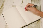 Girls hand writing in notebook.jpg